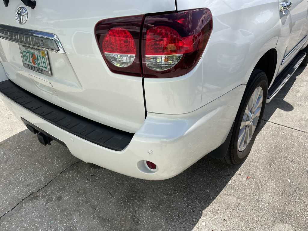 The same rear quarter panel after paintless dent repair — smooth, factory paint preserved